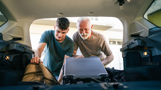 Student packing the car with his Dad. 