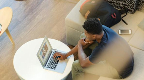 Student sitting in their student hall reception