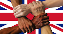 Four hands symbolise strength in unity by clenching each other's accompanying arms to form a square over the flag of the UK