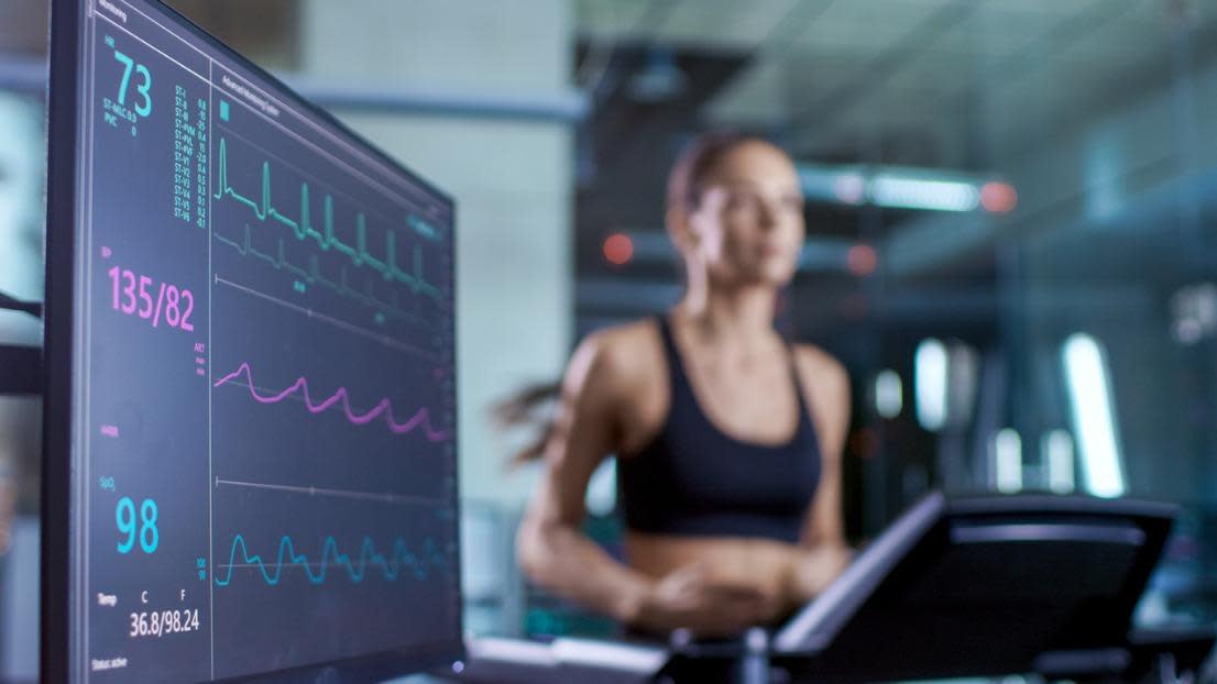 Medical monitor showing EKG reading of an athlete on a treadmill