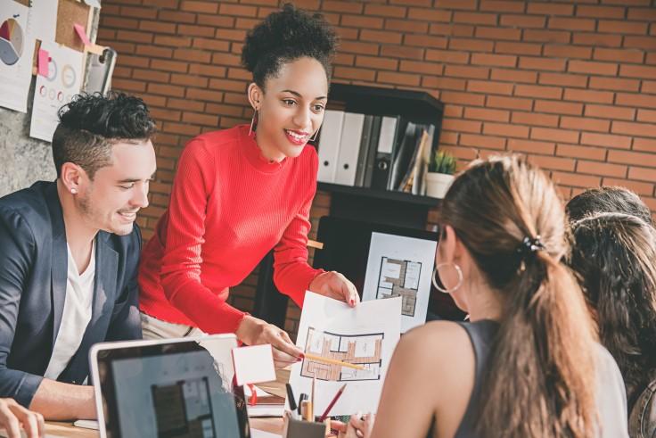 People discussing architectural plans