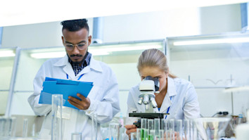 Two science students doing research in a lab