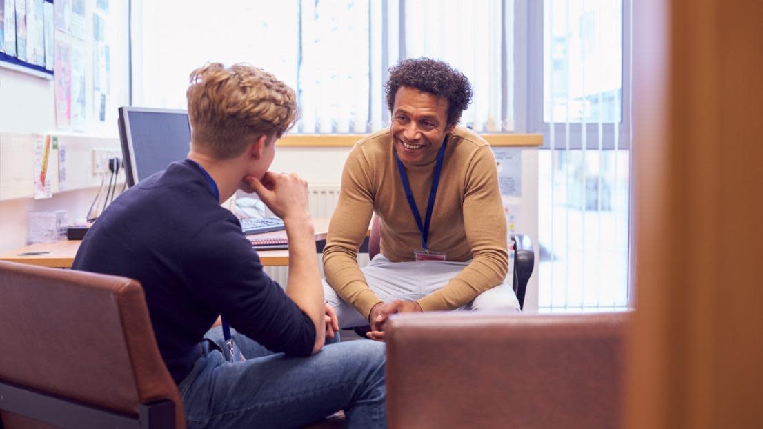 College Student Meeting With Campus Counselor