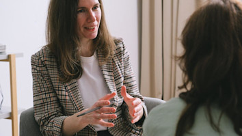 Counsellor with psychology degree speaking with client