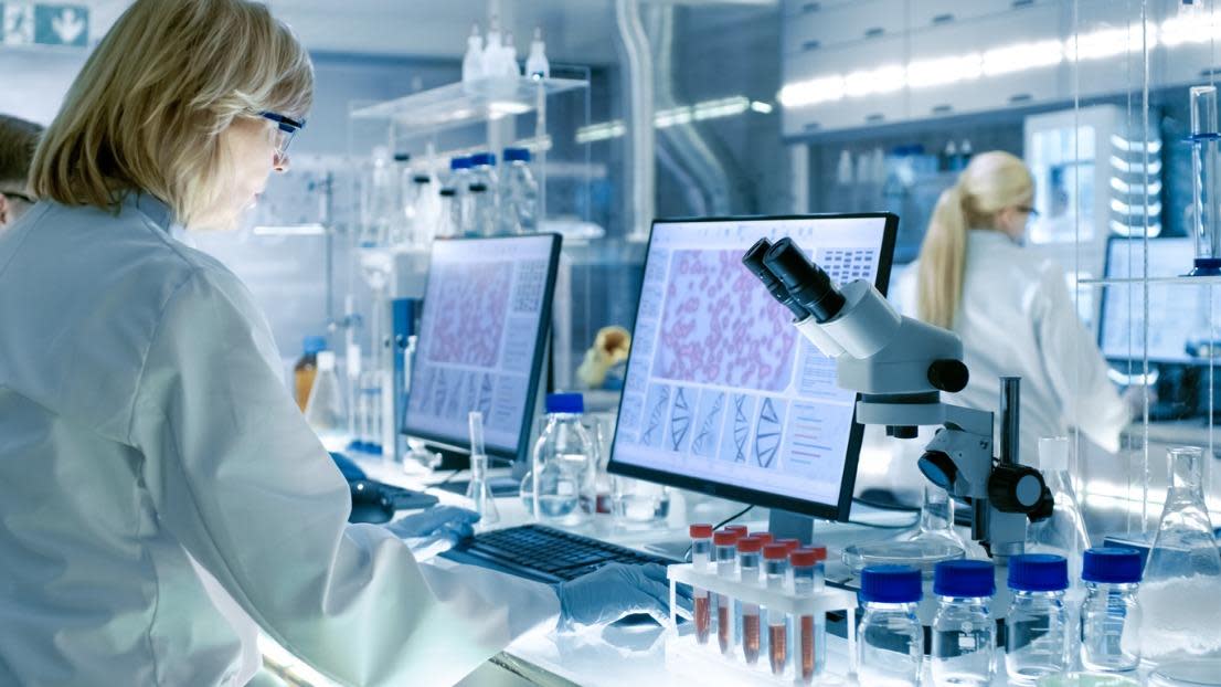 Scientist Works with High Tech Equipment in a Modern Laboratory