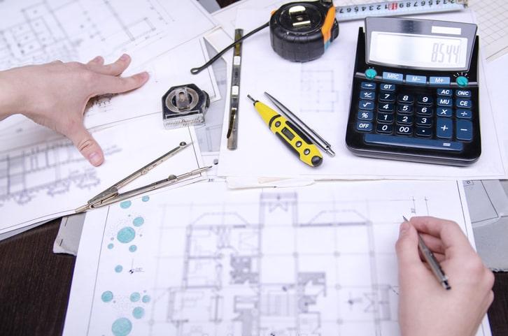 A civil engineer working on a civil drawing