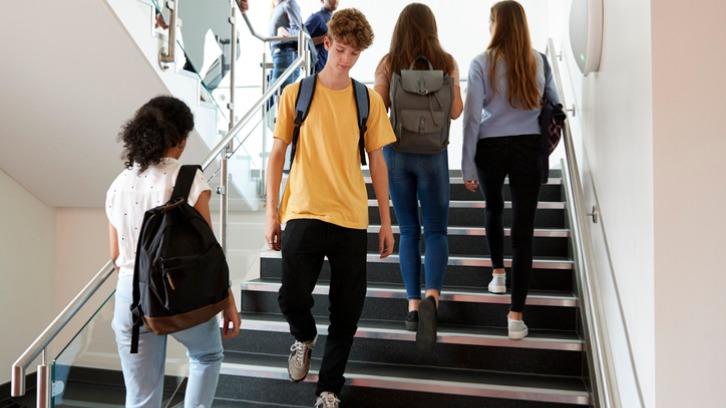 A Level students walking on school stairway