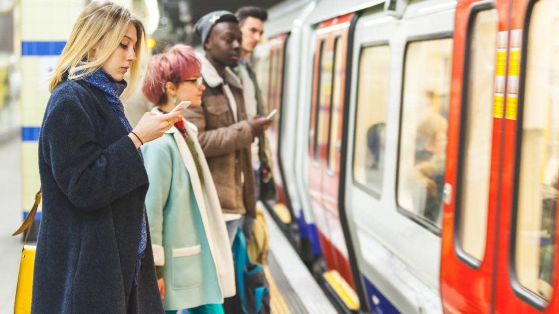 people waiting for the train at tube station