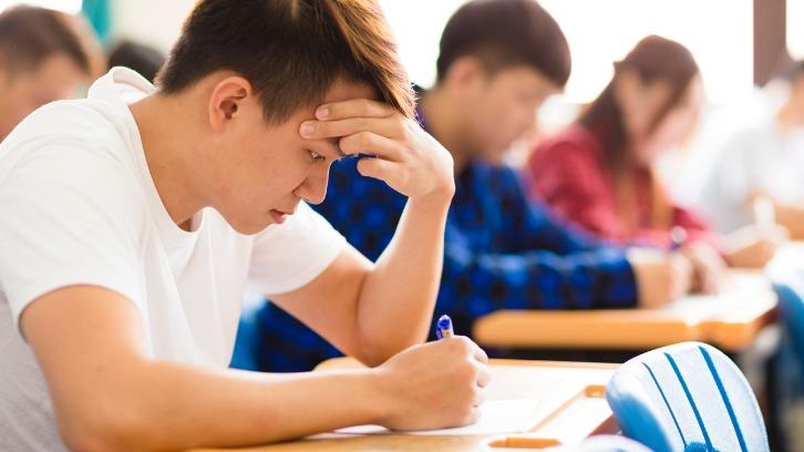 International university students writing an exam