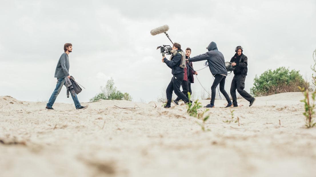Behind the scene film crew filming movie scene outdoor
