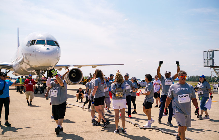 GDIT employees cheering after Dulles Plane Pull