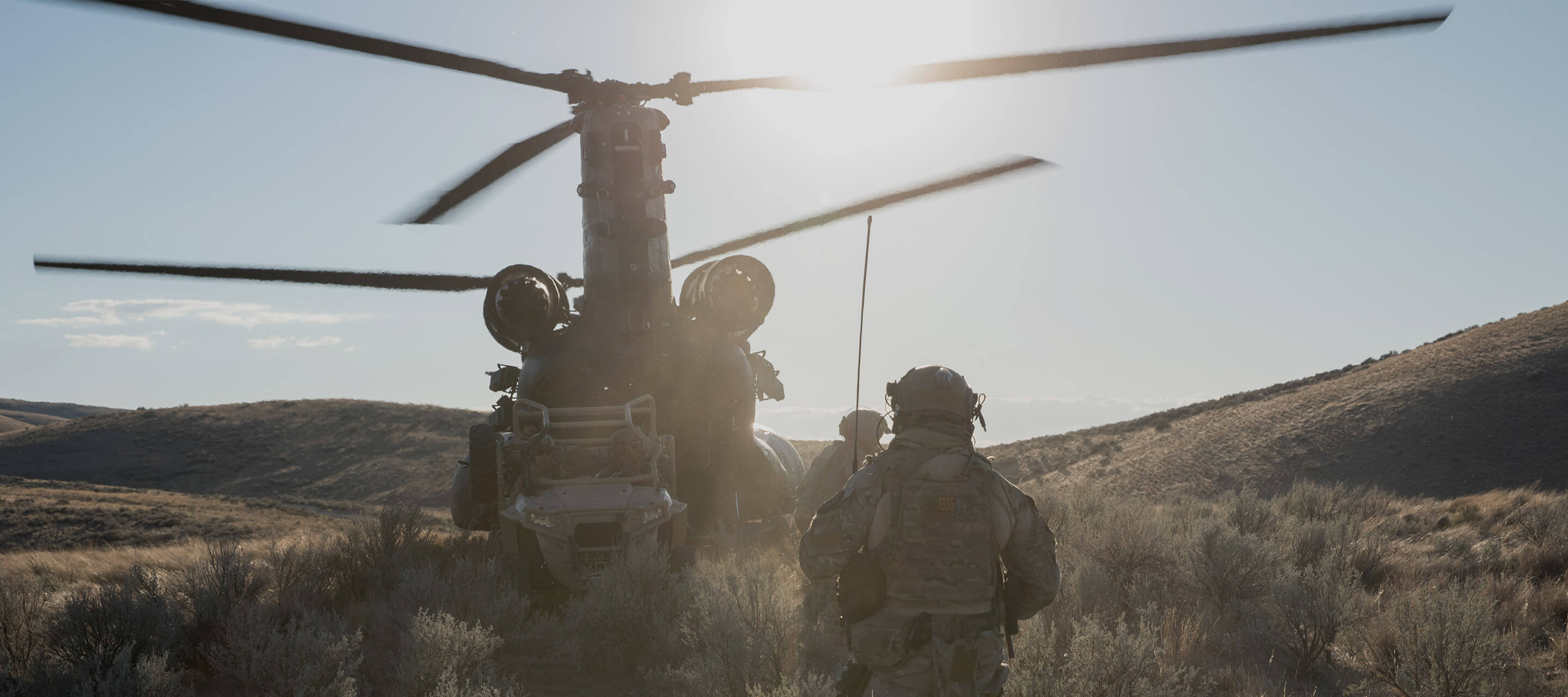 soldier walking towards helicopter