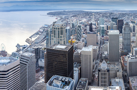 city skyline by a lake