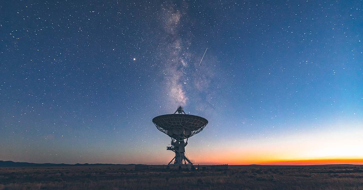 satellite with starry sky in background 