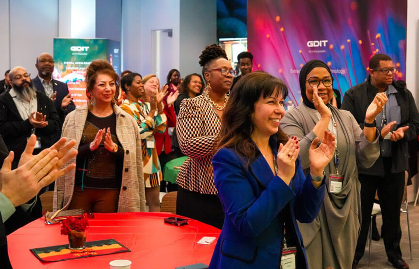 People clapping at a GDIT event