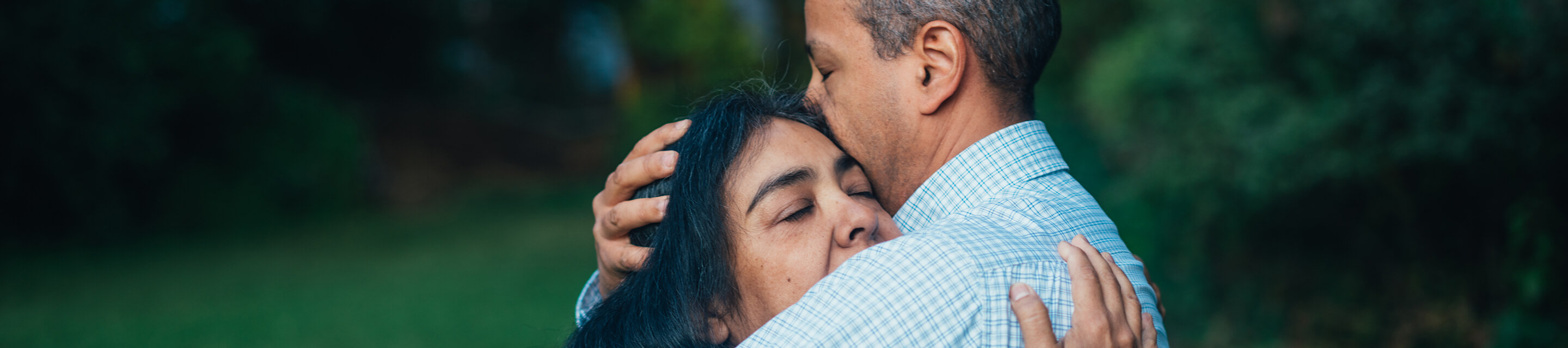 man and woman hugging