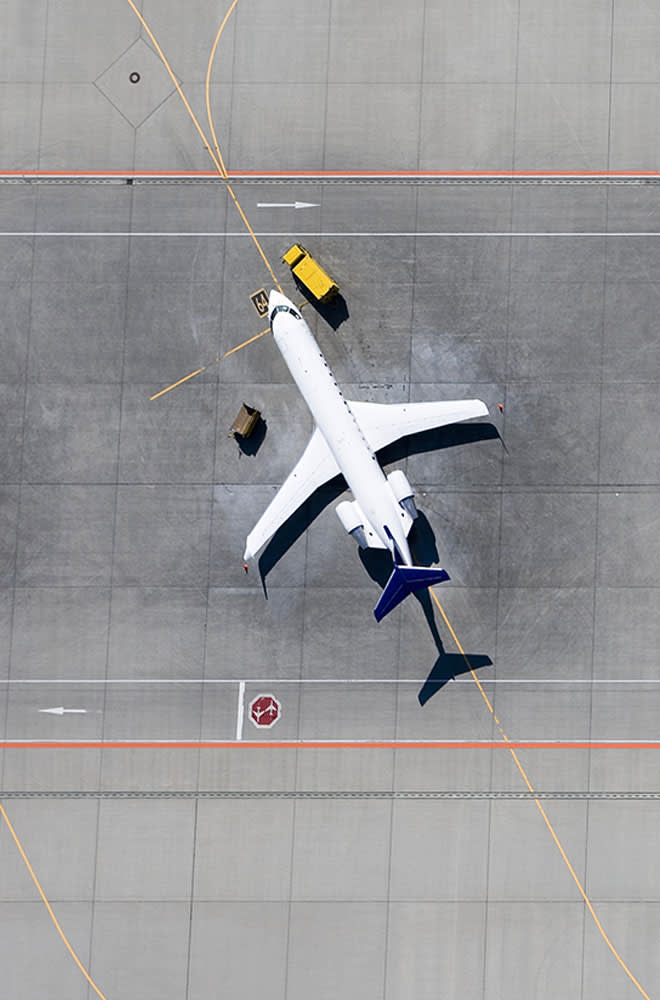 Overhead of airplane on a tarmac.