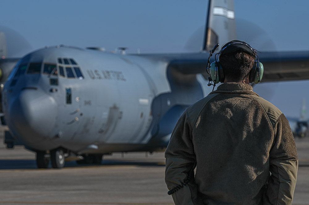 soldier looking at plane