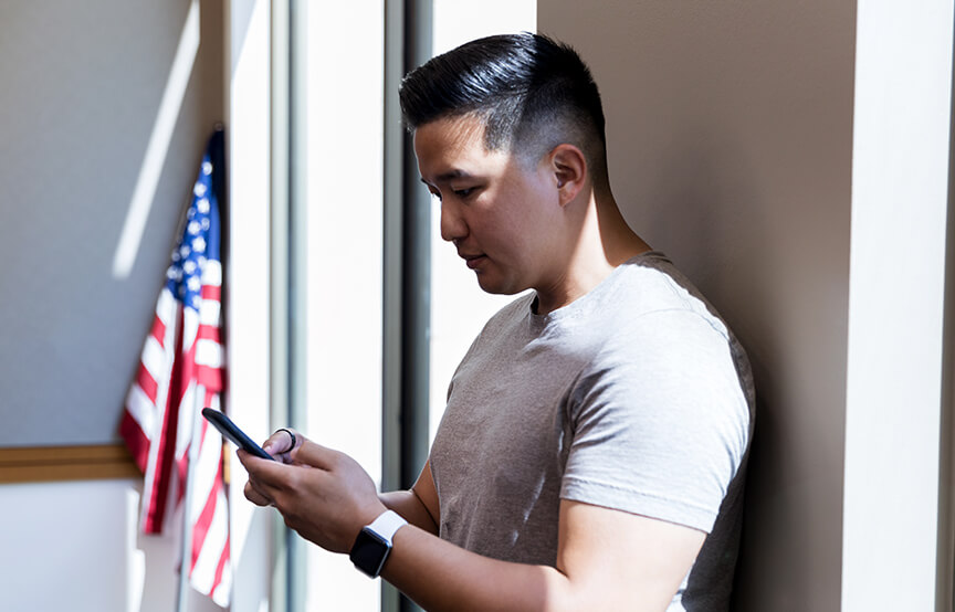 veteran looking at his phone