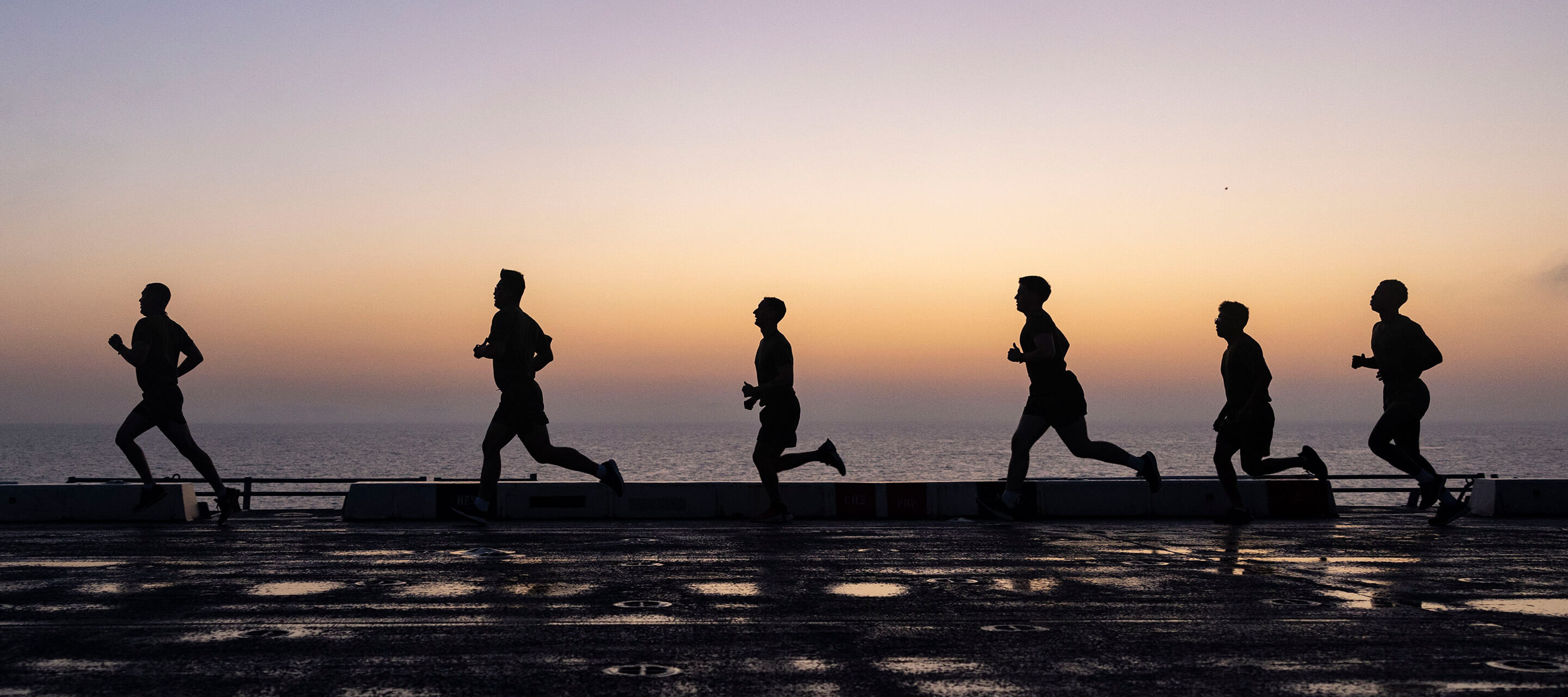 silhouettes of people running 