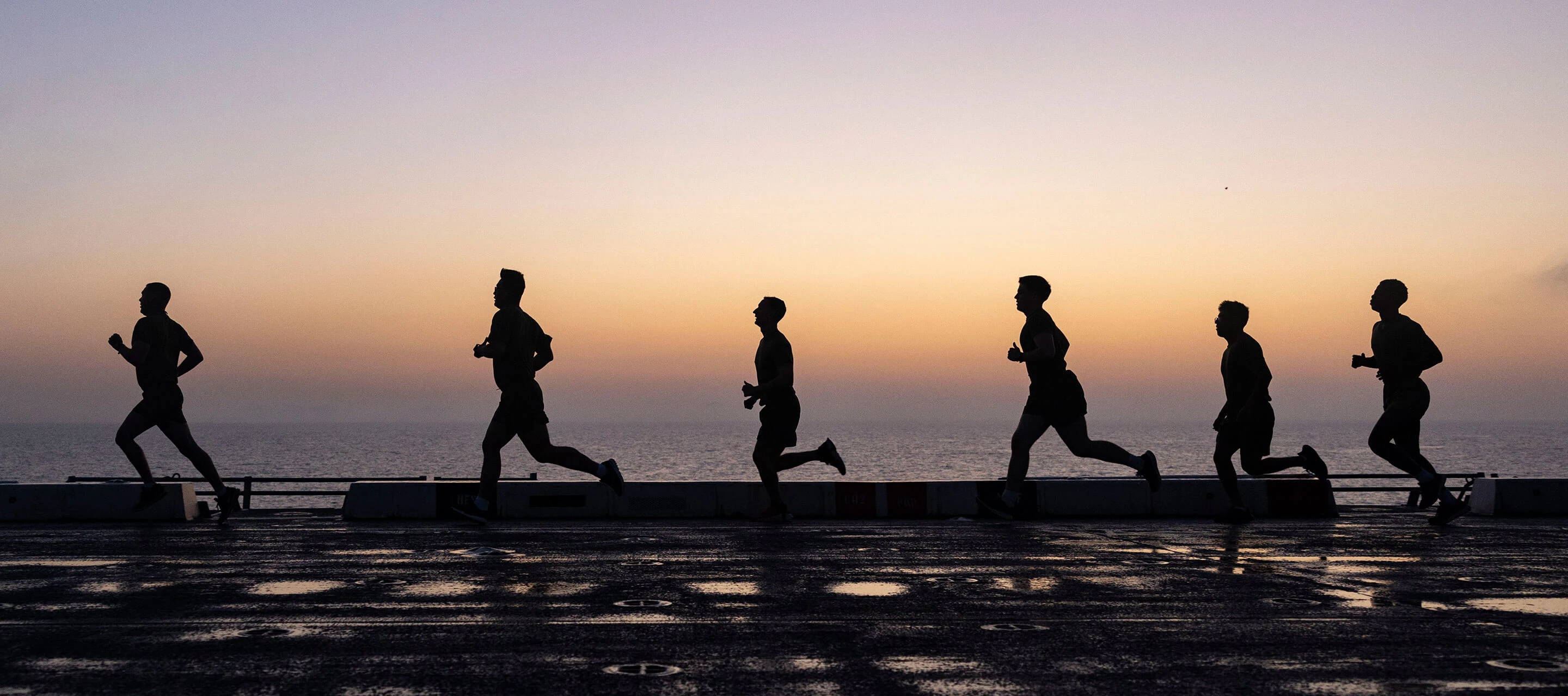 silhouettes of people running