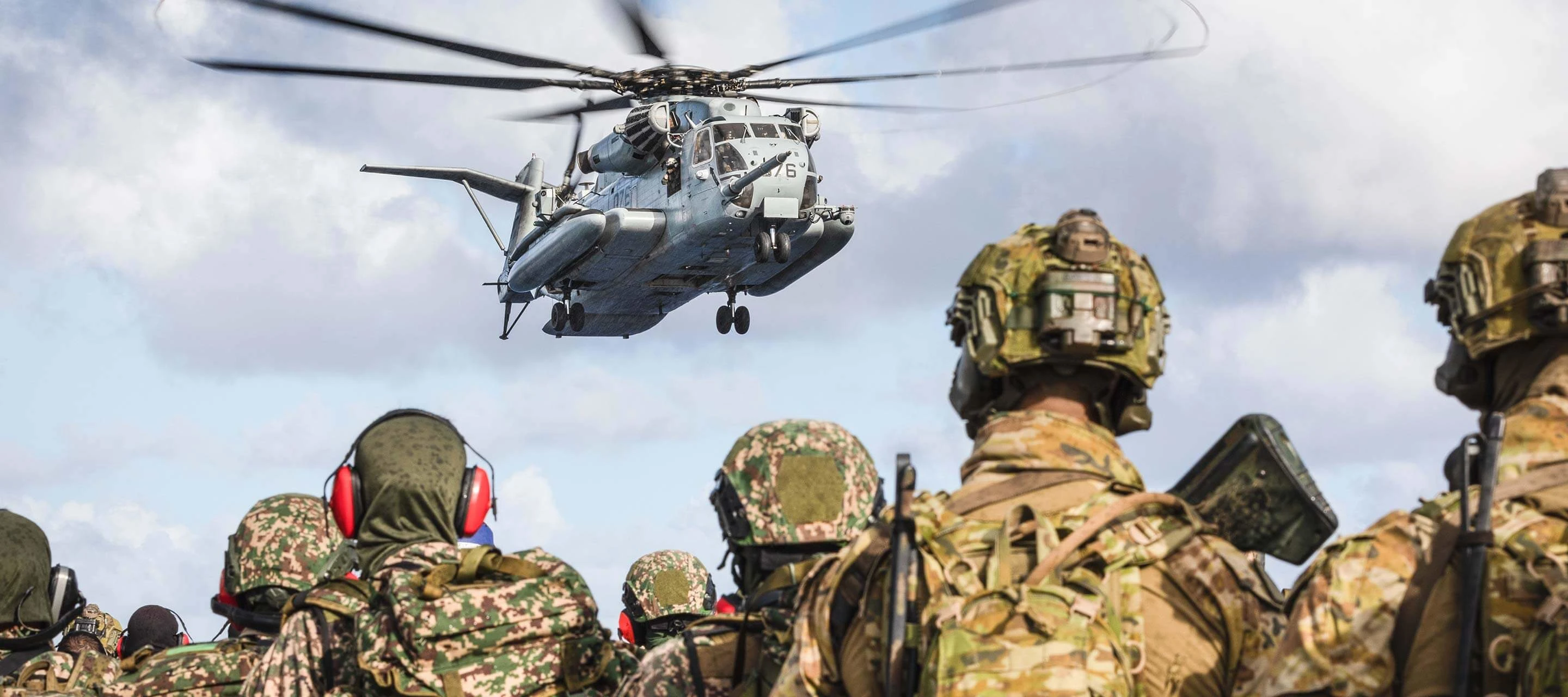 soldiers looking at a helicopter