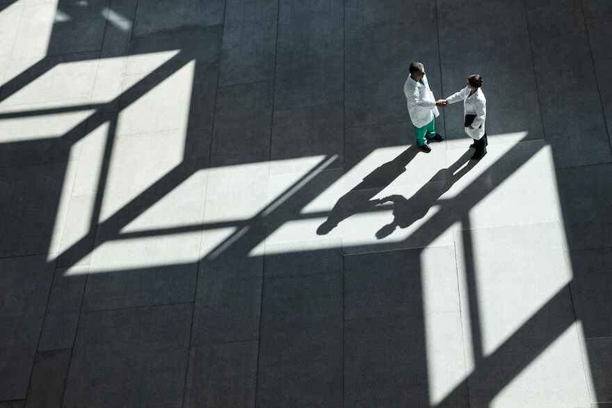 two doctors shaking hands