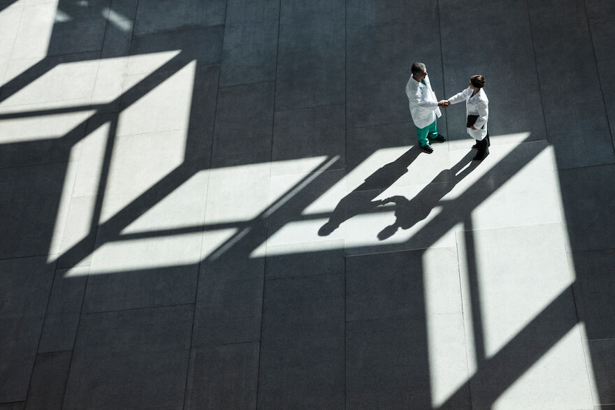 two doctors shaking hands