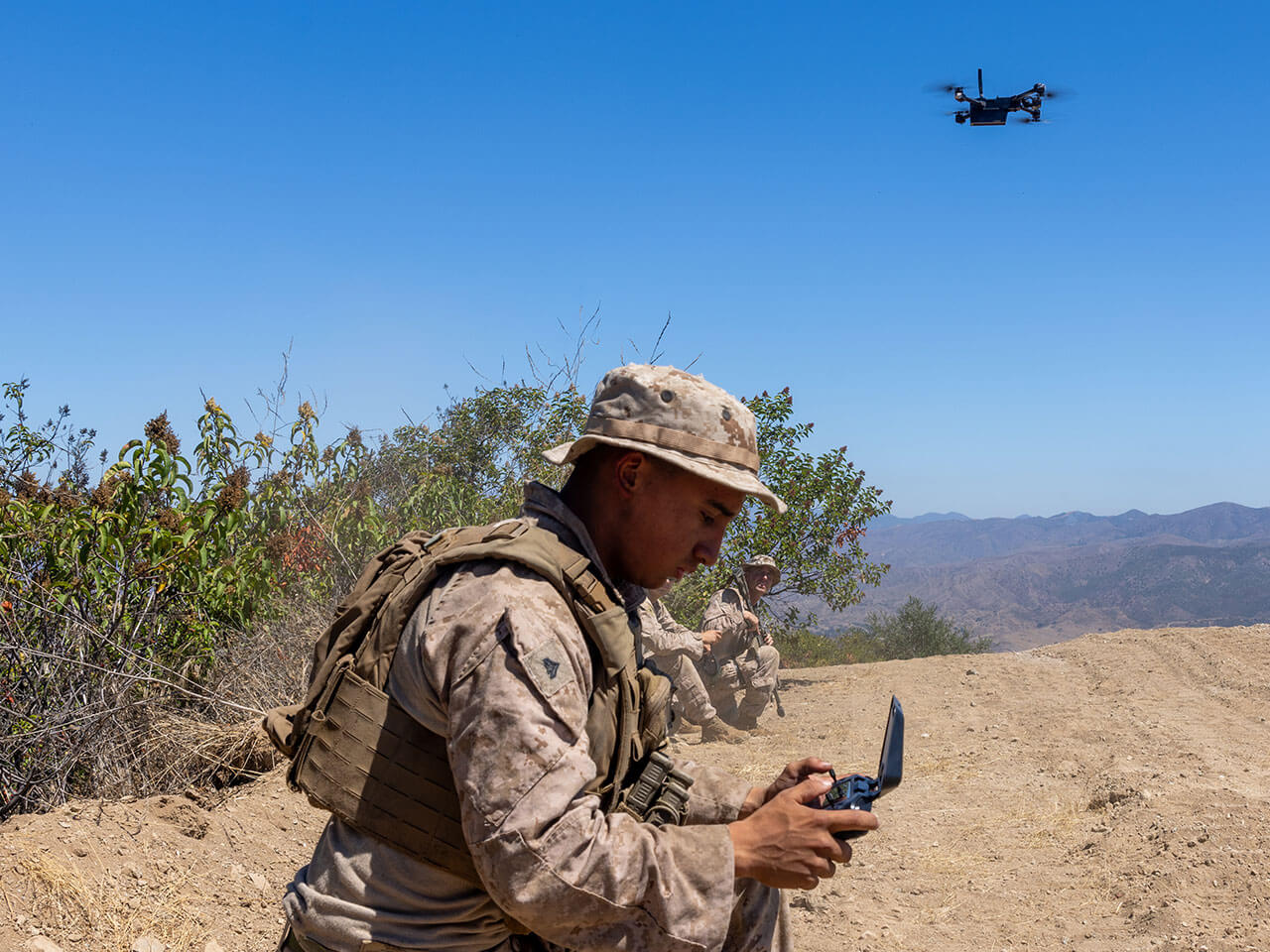 soldier controlling a drone