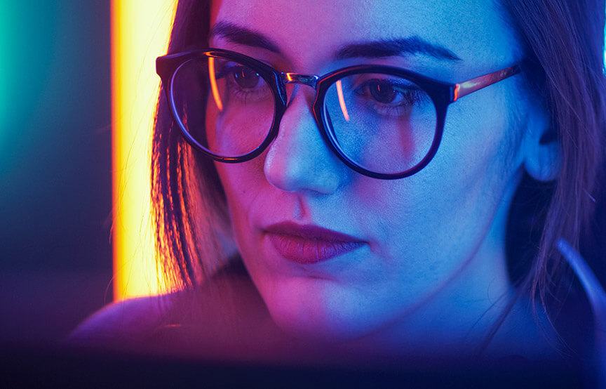 Girl Sitting Before Computer, Browsing in Internet