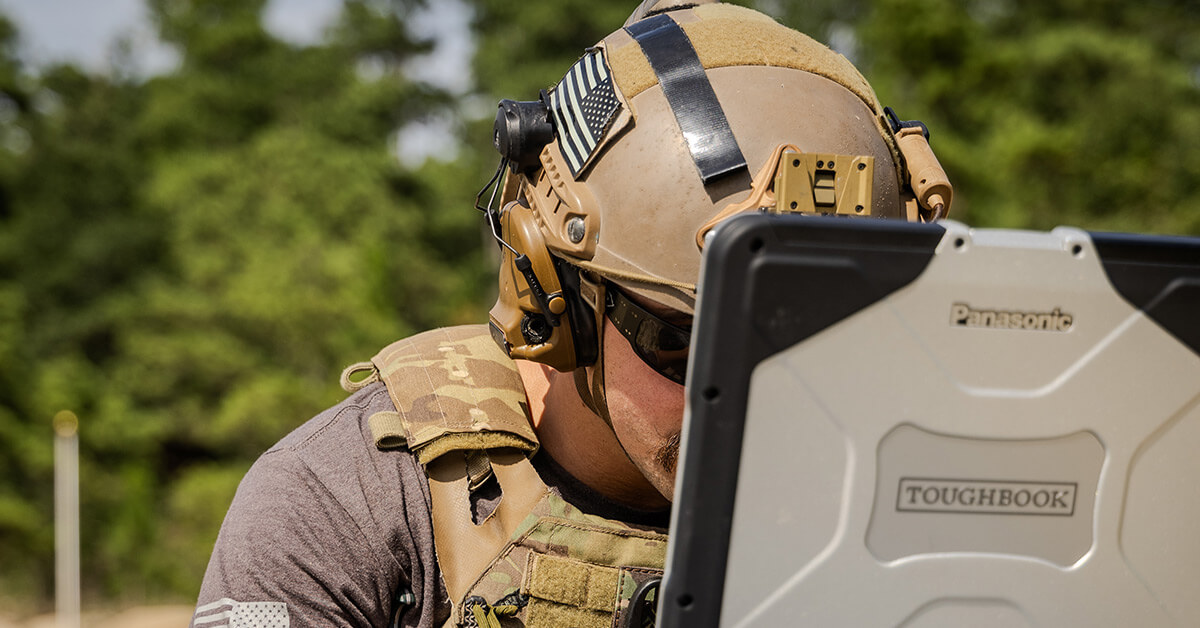 soldier looking at computer 