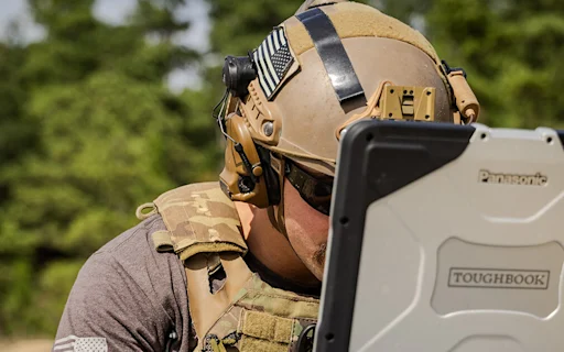 soldier looking at computer