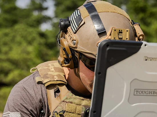 soldier looking at computer