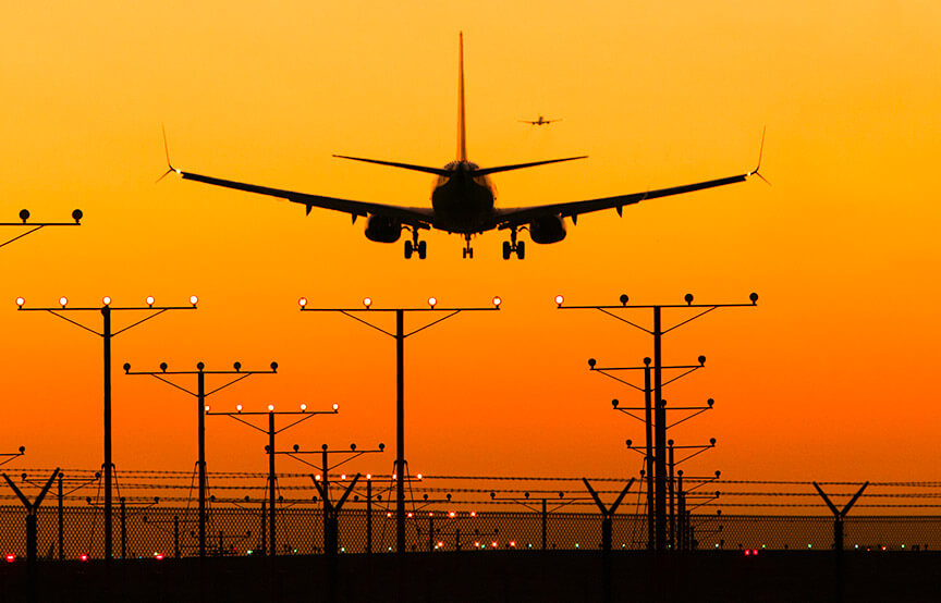 plan taking off on runway