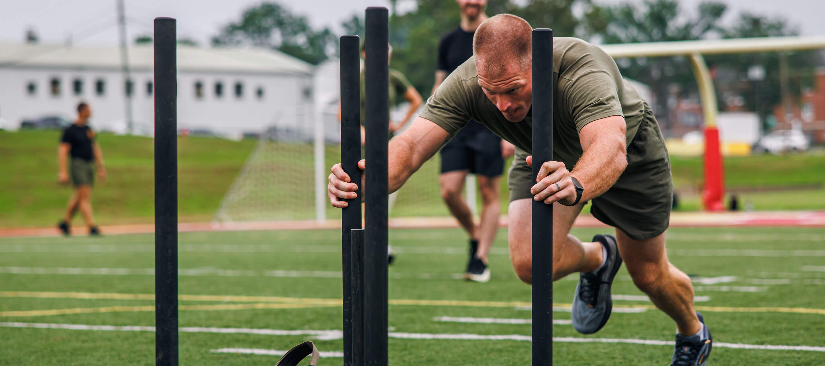 man pushing weights