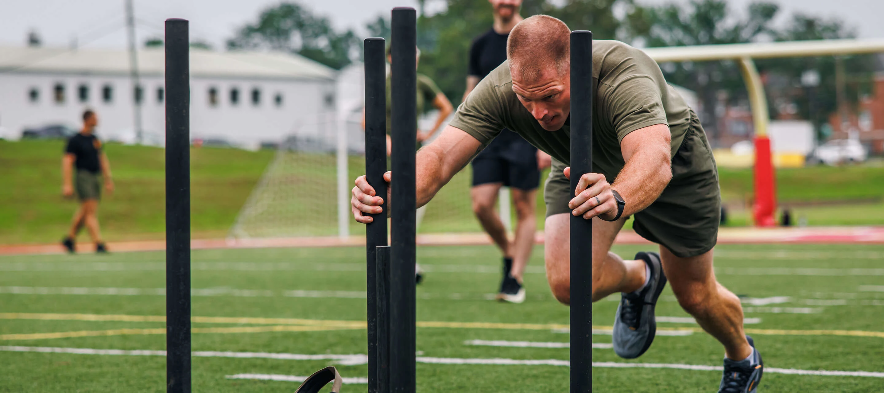 man pushing weights