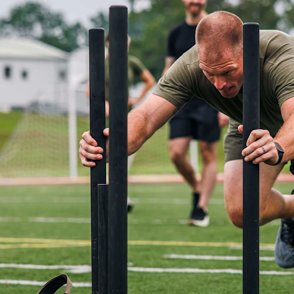 man pushing weights