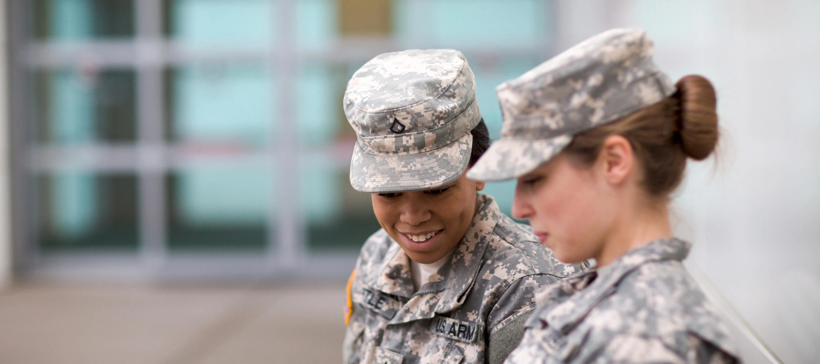 two people in service uniform speaking