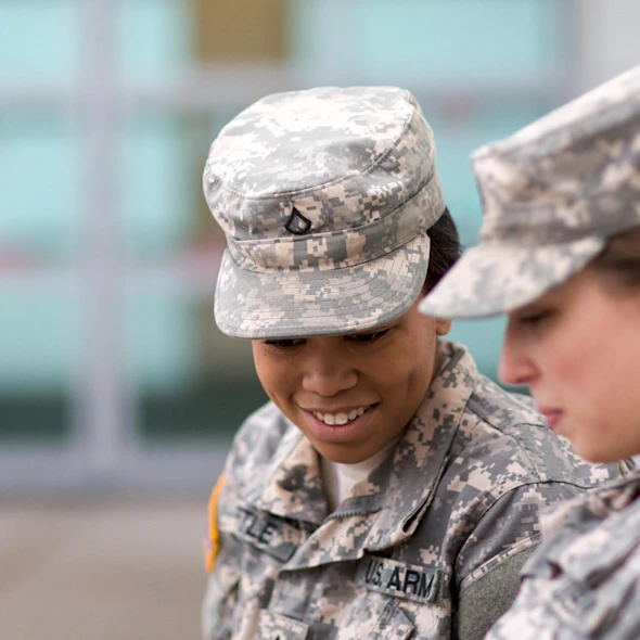 two people in service uniform speaking