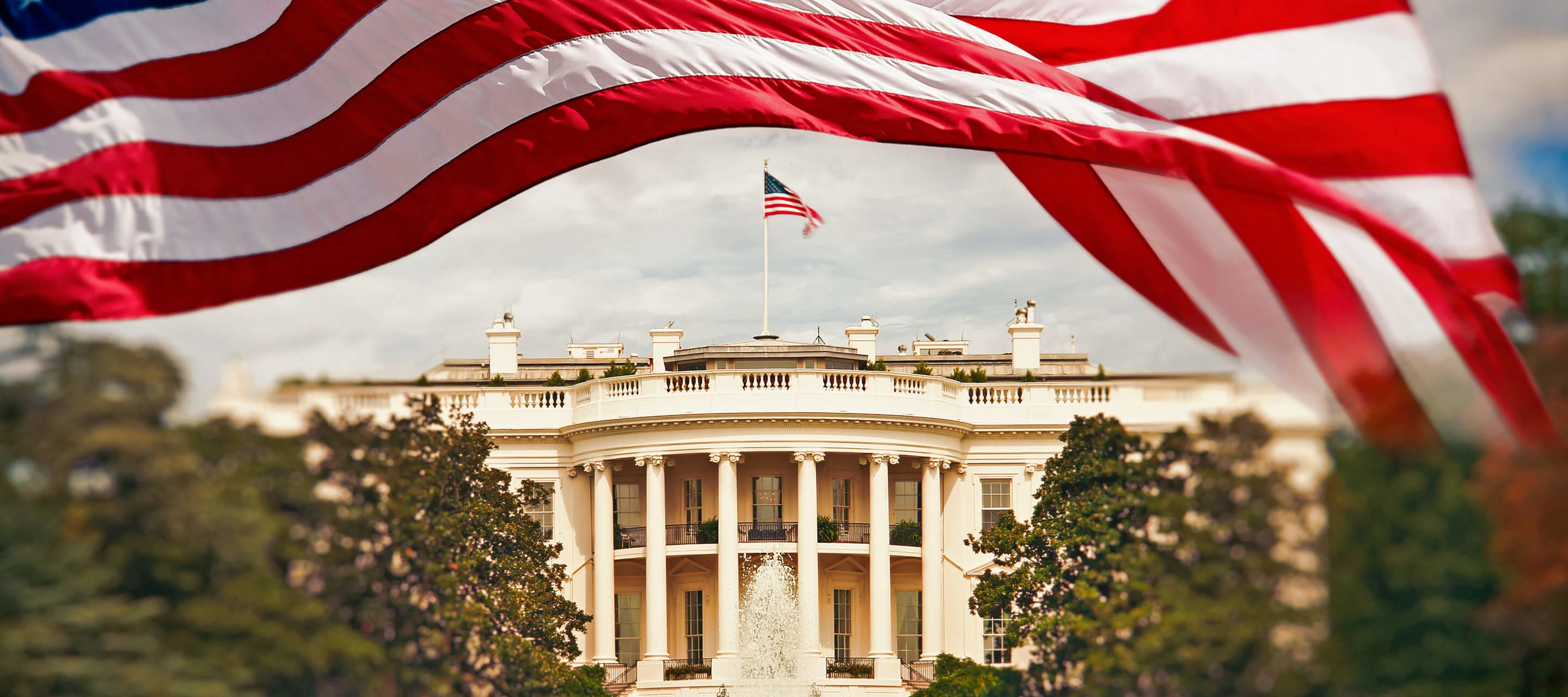 White House with American flag waving above