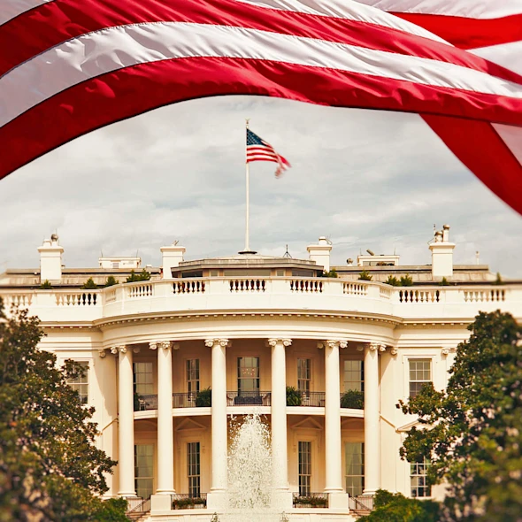 White House with American flag waving above