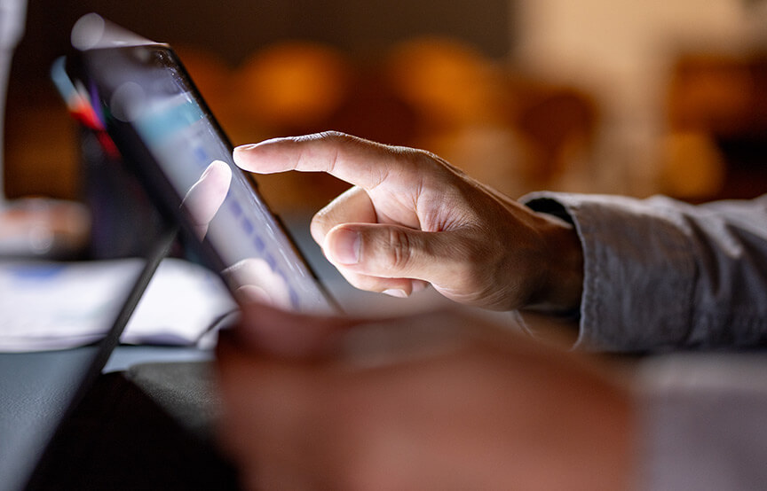 person touching laptop