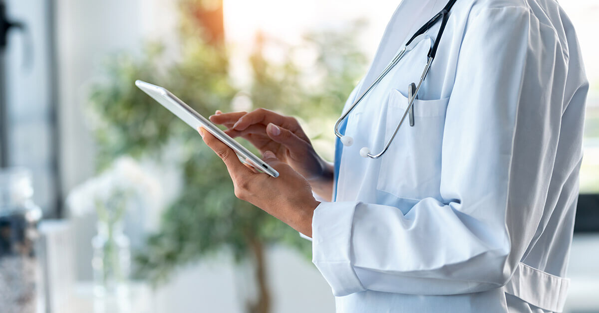 doctor looking at tablet