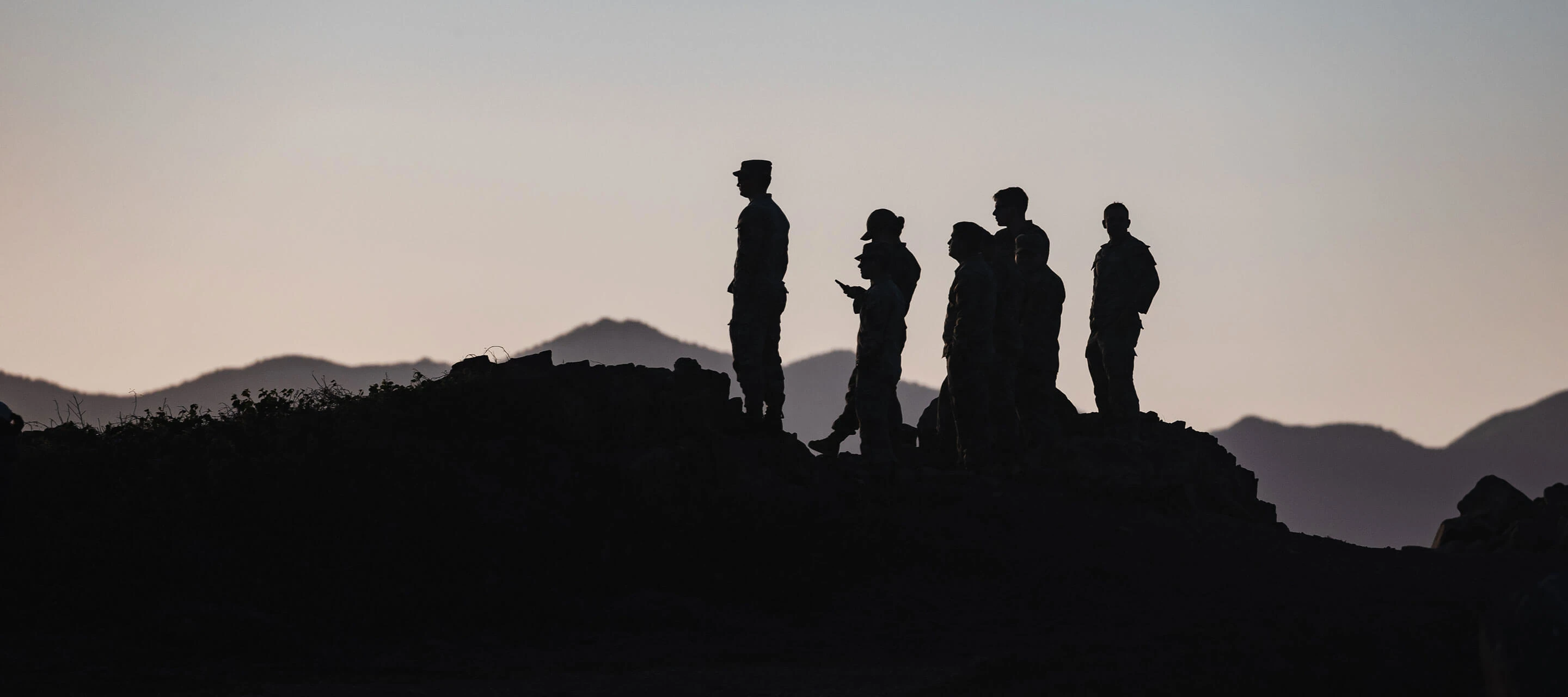 shadows of soldiers standing on mountains
