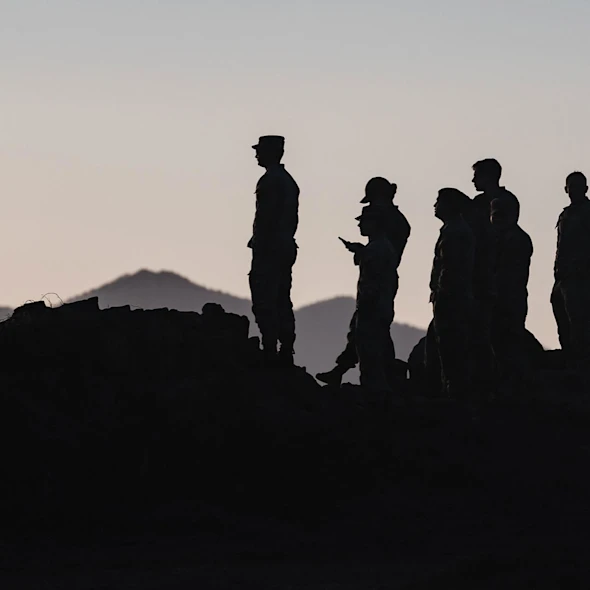 shadows of soldiers standing on mountains