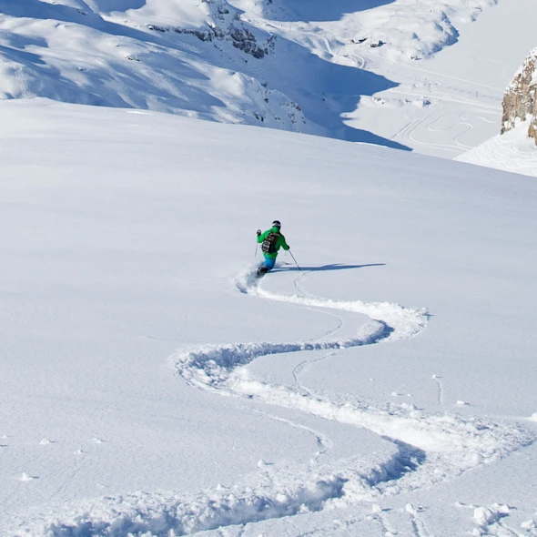 skier going down mountains
