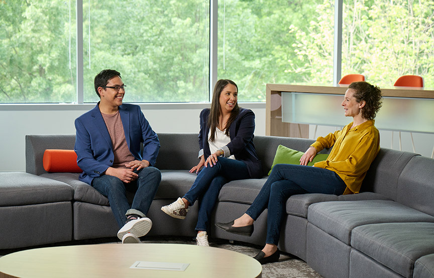 colleagues gathered on couch 