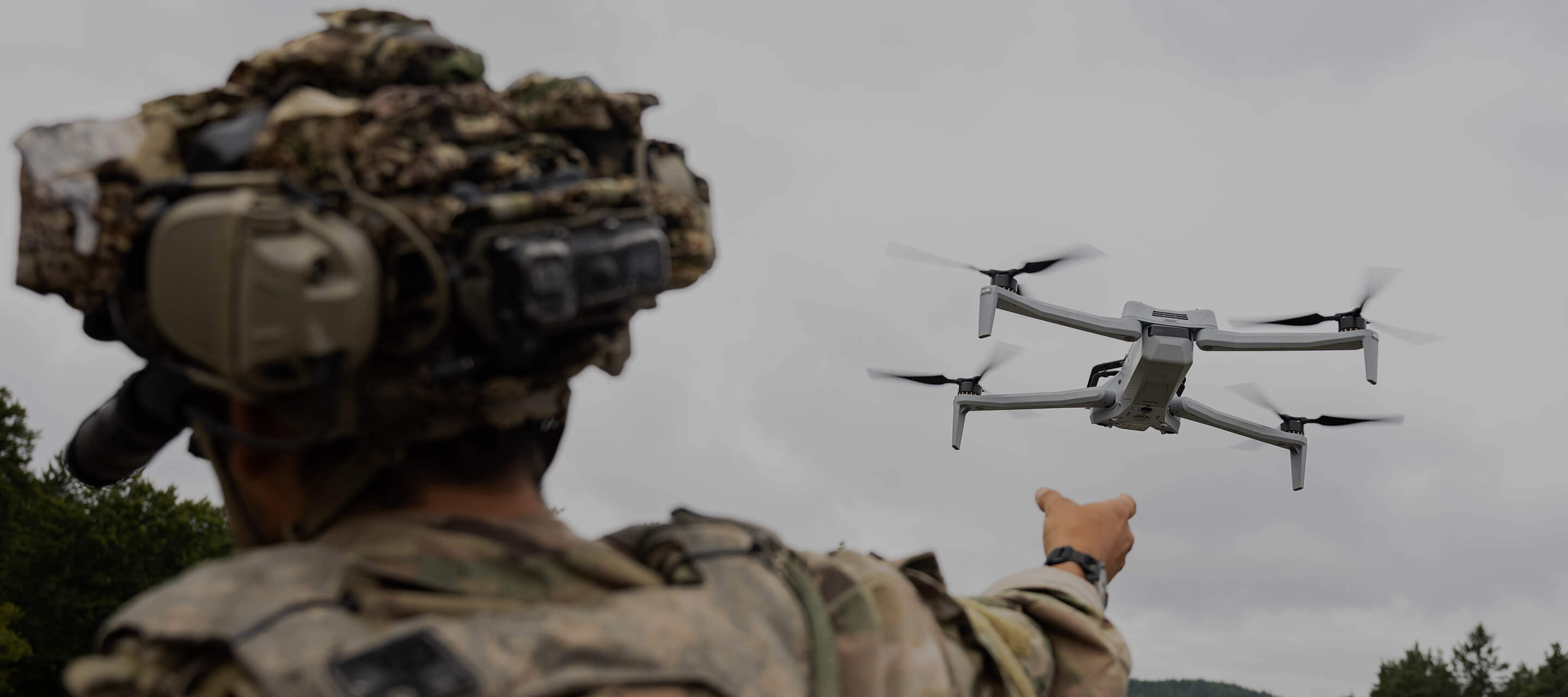 soldier pointing to drone