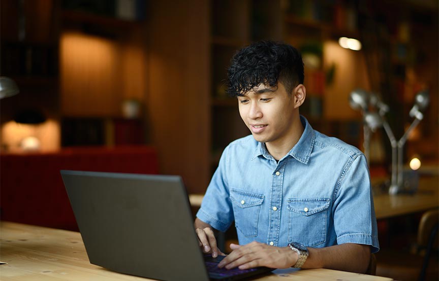 man sitting at laptop 