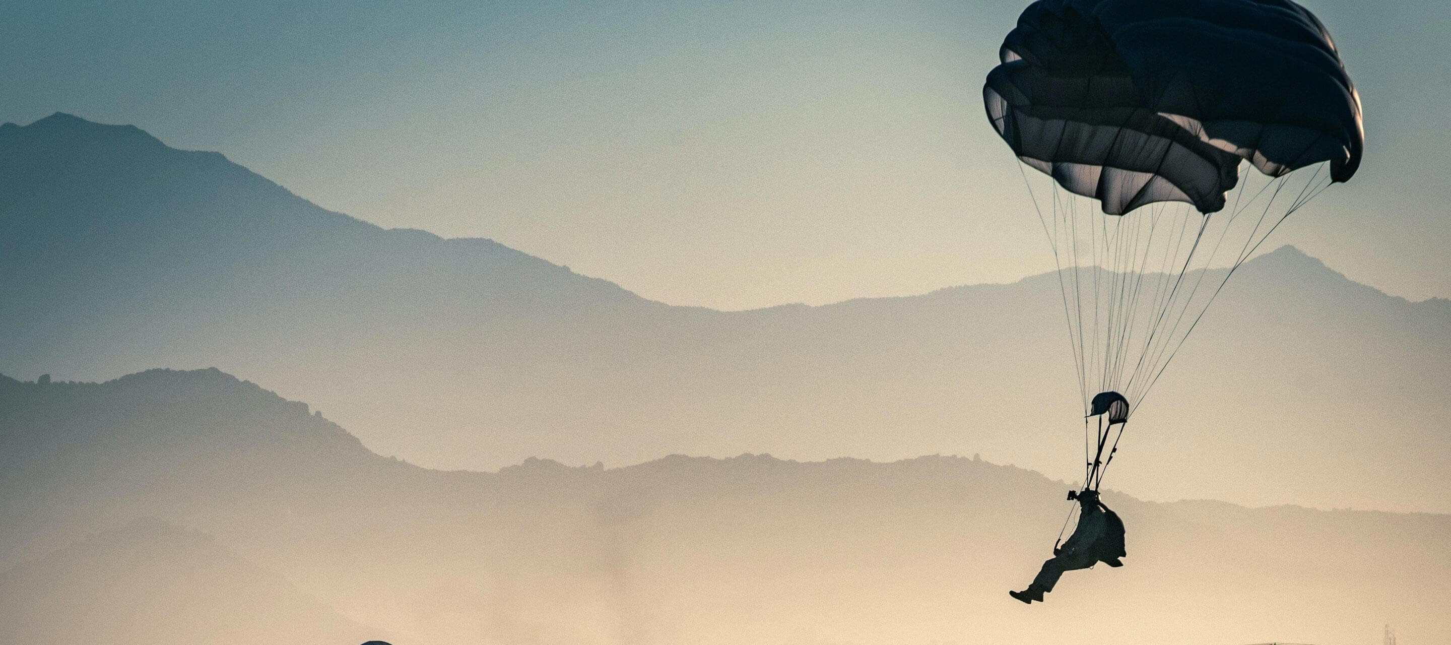 Solider descending on a parachute 